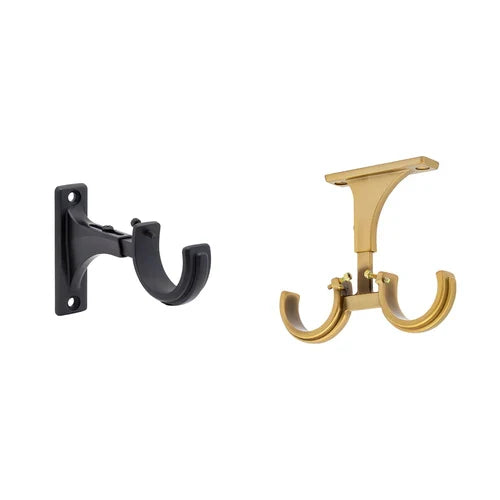 Two Kirsch desiner metals  wall-mounted brackets shown side by side on a plain white background: one in matte black and one in polished gold.